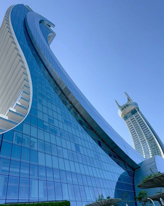 Modern glass façade in Doha, Qatar — drone-accessible curtain-wall cleaning by SKYNA